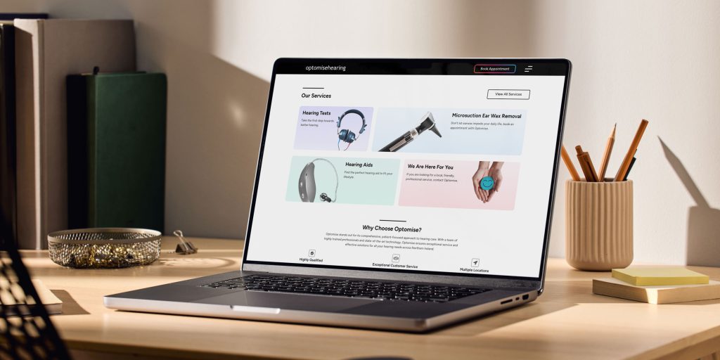 We Are Kaizen Optomise hearing website page showing on laptop
